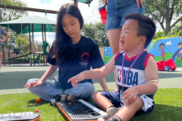 A child sitting playing music