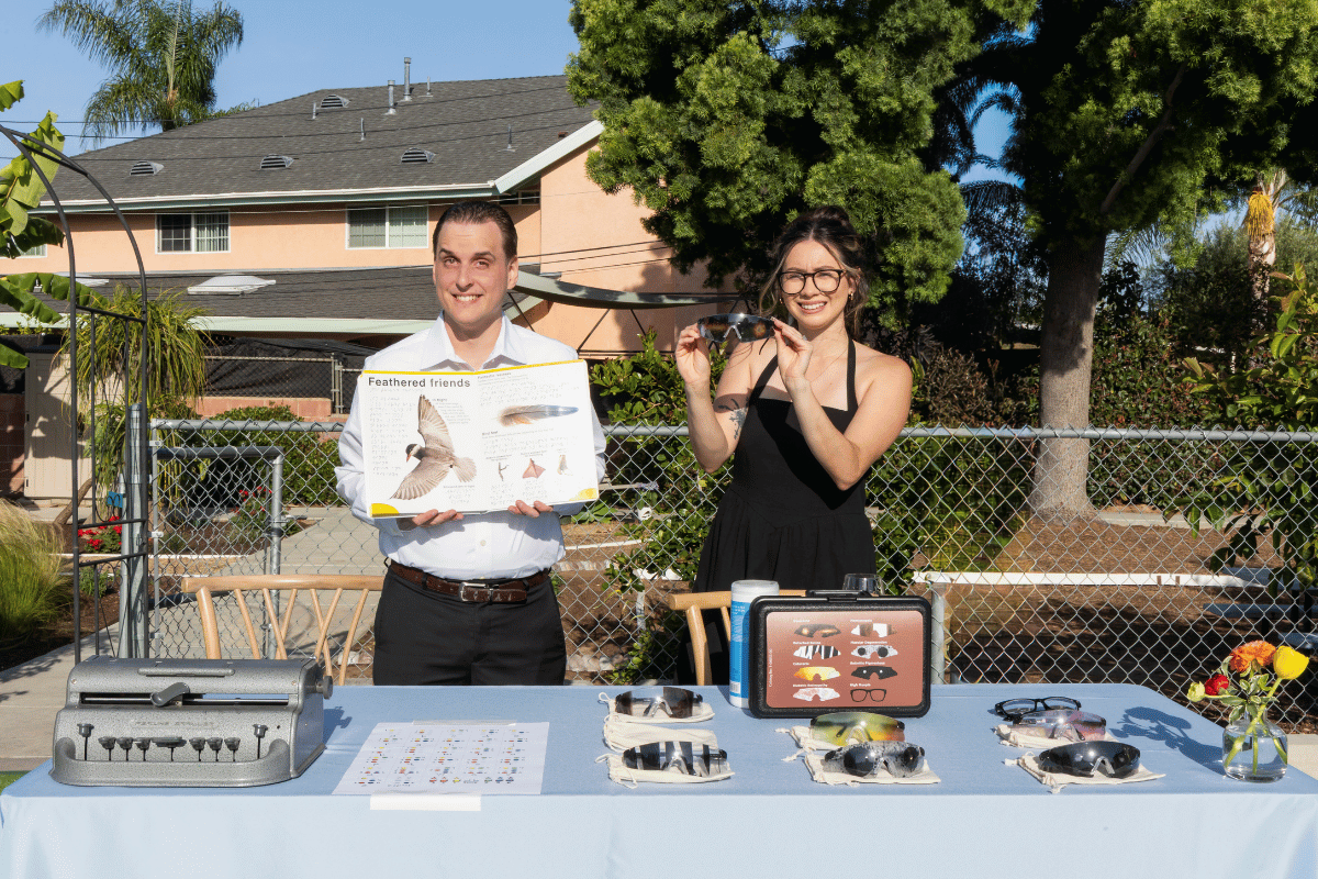 Two people stand in front of accessible technology