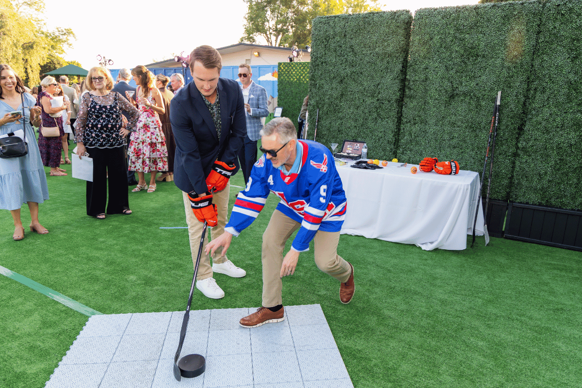Two men at a blind hockey demo