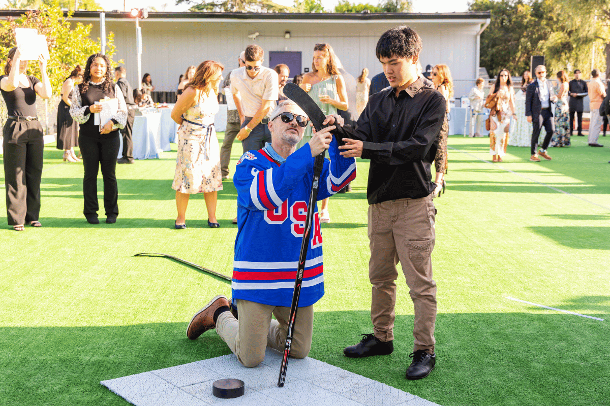 Blind hockey demonstration with two people